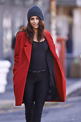 Image showing Fashion, smile and portrait of woman in city with stylish, trendy and elegant coat for outfit. Happy, beautiful and young female person with classy style with beanie for winter season in urban town.