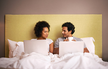 Image showing Bedroom, laptop and couple with smile for working from home in apartment, love and writers for romance. Partners, woman and man on bed of house with technology for career and coffee in morning