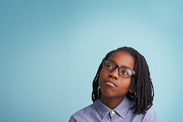 Image showing Glasses, thinking or boy kid in studio with vision, solution or problem solving mockup on blue background. Question, why or African teen model with idea for brainstorming, guess or memory reflection