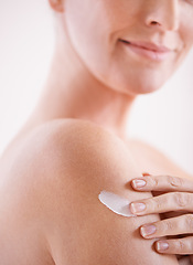 Image showing Woman, skincare and arm with cream for application, dermatology and cosmetics for wellness with smile. Female person, happy and body with product for self care, moisturizer or lotion for skin glow