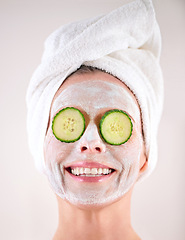 Image showing Spa, mask or woman with cucumber facial, skincare in studio with natural detox, smile or cosmetics. Happy model, confidence or face with lotion for anti aging treatment or beauty on white background