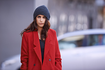 Image showing Winter, fashion and portrait of woman in city with jacket for travel in cool style or red coat. Streetwear, clothes and girl outdoor on sidewalk with confidence and pride in New York morning commute