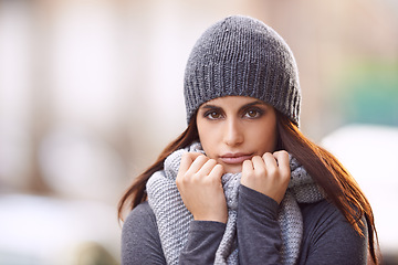 Image showing Fashion, serious and portrait of woman in city with stylish, trendy and elegant coat for outfit. Travel, beautiful and female person with classy style with beanie for winter season in urban town.