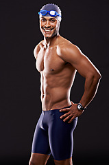 Image showing Studio, happiness and swimmer smile, portrait and workout for sport and exercise for body. Athlete, adult and male person with strength, professional and champion for career in black background