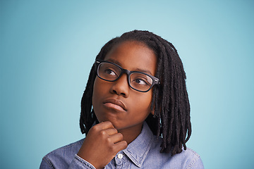 Image showing Thinking, glasses or black kid in studio with vision, solution or problem solving guess on blue background. Question, why or African teen model with emoji idea for brainstorming, memory or reflection