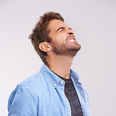 Image showing Burnout, angry and frustrated with man, stress and facial expression on a grey studio background. Body language, person and model with emotions and furious with anxiety and anger with aggressive