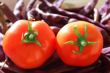 Image showing red tomatoes and lilac pods of haricot