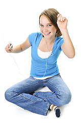 Image showing Teenage girl listening to music