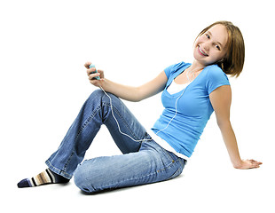 Image showing Teenage girl listening to music