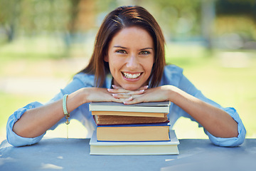 Image showing Woman, student and portrait with books for outdoor learning, education and knowledge in park or campus. Face of a happy young person with literature, university and resources for studying at a table