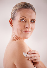 Image showing Mature woman, cream and studio with treatment, portrait and cosmetic with skincare. Model, beauty and luxury with body, cosmetics and care for anti ageing and healthy skin for wellness and confidence