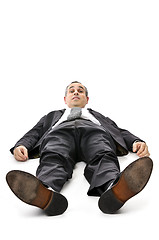 Image showing Businessman laying down on white background