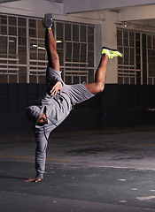 Image showing Breakdance, man and handstand with fitness outdoor for training, practice and workout in warehouse. Dancer, street dance and hip hop dancing in building with performance, stunt and flexible movement