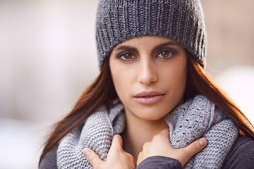 Image showing Style, serious and portrait of woman in city with stylish, trendy and elegant coat for outfit. Travel, beautiful and female person with classy fashion with beanie for winter season in urban town.