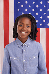 Image showing Black child, portrait and American flag background for pride, citizenship and education or learning. Happy face of a young kid, student or boy from the USA with support for country and patriotism