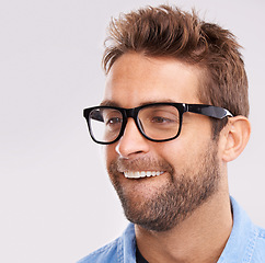 Image showing Silly face, nerd and man with glasses, happiness and facial expression on a grey studio background. Model, eyewear and person with goofy guy and reaction with character and quirky with comedy or joke