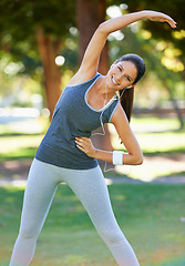 Image showing Portrait, woman and happy with earphones for stretching, workout and podcast for exercise motivation. Female person, smile and fitness in park with balance warm up, training and music in headphones