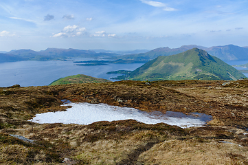 Image showing Serene highland vista overlooking a crystalline fjord amidst mou