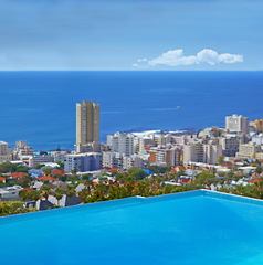 Image showing Swimming pool, city and building or ocean outdoor at travel destination in summer for hotel, infrastructure or downtown. Skyline, water and lodge accommodation in Cape Town or relax, trip or vacation