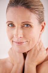 Image showing Glow, portrait or mature woman with beauty, confidence or facial treatment in studio on white background. Face, skincare benefits or model with natural shine, smile or anti aging cosmetics results