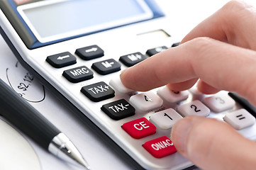 Image showing Tax calculator and pen