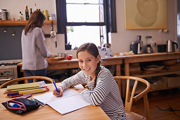 Image showing Girl, child and homework with portrait in kitchen for studying, development and notes for education in house. Kid, notebook and writing with learning, language and smile for assessment in family home