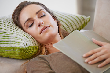 Image showing Woman, book and sofa sleeping in home for weekend nap in living room for wellness, holiday vacation or calm. Female person, magazine and comfortable or tired in apartment for casual, peace or resting