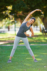 Image showing Portrait, woman and happy with headphones for stretching, exercise and podcast for training motivation. Female person, smile and fitness in park with balance warm up, wellness and music in earphones