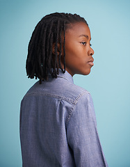 Image showing Thinking, idea and black boy kid in studio with why, questions or memory on blue background. Planning, child development and African teen model with vision for solution, problem solving or reflection