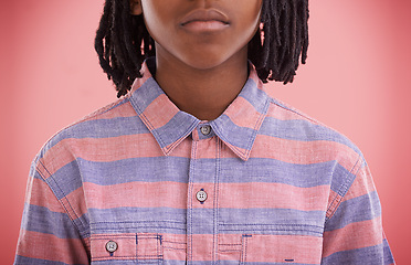 Image showing Fashion, child and shirt with style, trendy and modern clothing of a African boy in a studio. Youth, hipster and casual clothes with a kid and cool teen top with pink background and serious face