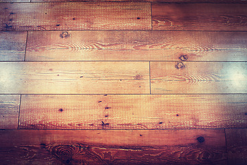 Image showing Texture, laminated and closeup of wooden floor at house in room for vintage interior design. Luxury, retro and zoom of brown natural timber ground with classic textile in modern home or apartment.