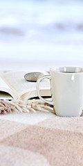 Image showing Relaxing reading with tea