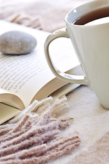 Image showing Relaxing reading with tea