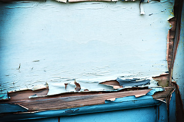 Image showing Peeling, paint and wall with wood outdoor of house with damage on old siding from age or weather. Ancient, wallpaper and closeup on texture of building with blue, color and home renovation project
