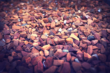 Image showing Gravel, rock and stone on ground closeup outdoor with detail on texture of environment or dirt road. Rocky, material and wallpaper of natural pebbles in nature or background with grit and no people