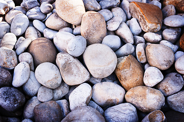 Image showing Rock, pile and stone on ground closeup outdoor with detail on texture of environment and nature. Rocky, material and wallpaper of natural geology stack of pebbles in background with no people