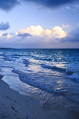 Image showing Ocean waves on beach at dusk