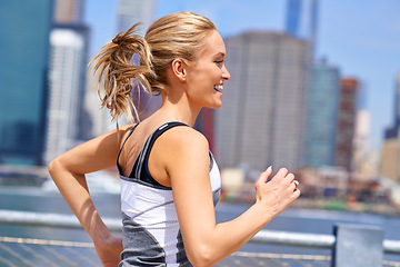 Image showing Woman, excited and running for fitness in city, jogging active and fit female person exercising in New York. Energy, marathon for sports training and workout for athlete, cardio wellness or endurance