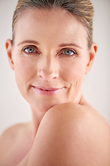 Image showing Woman, smile and studio with skincare, portrait and cosmetic with treatment. Model, mature and beauty with body, cosmetics and care for anti ageing and healthy skin with wellness and confidence