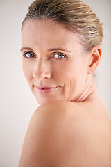 Image showing Model, mature and studio with skincare, portrait and cosmetic with treatment. Woman, beauty and luxury with body, cosmetics and care for anti ageing and healthy skin with wellness and confidence