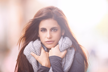 Image showing Portrait, outdoor and winter with woman, fashion and happy in the street and urban town. Face, New York and girl with casual outfit and cold with person and warm clothes with scarf, peace and walking