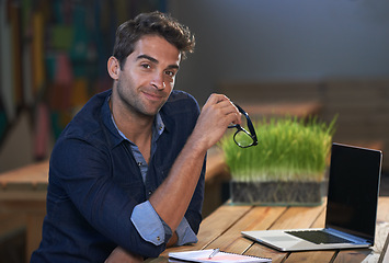 Image showing Portrait, relax or man on laptop for research, information and email for blog, article and copywriting in a startup. Journalist, freelancer and confident writer on break in modern office with notes