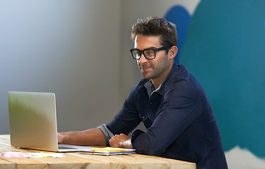 Image showing Smile, creative and man at laptop thinking for ideas, online research and reading email in office with glasses. Brainstorming, computer and designer at desk with business plan in professional career