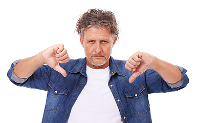 Image showing Senior man, portrait and thumbs down, feedback or opinion with hand gesture for disagreement on white background. No, rejection and voting with anger, disappointment and negative review in studio