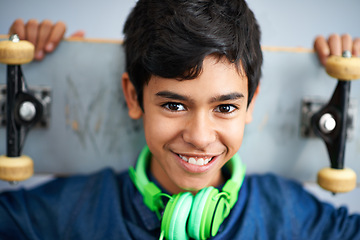 Image showing Portrait, smile and boy with skateboard, headphones and happiness with music and cheerful. Kid, face and childhood with skater or headset with joy and hobby with recreation and gen z with confidence