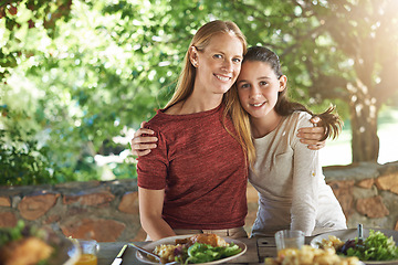 Image showing Portrait, hug and food with mother, girl and happiness with healthy meal and social gathering with nature. Face, embrace and family with parent and mama with daughter and child with lunch and smile