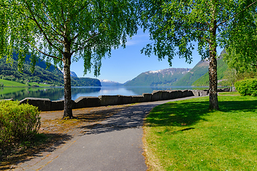 Image showing Serene morning walk by the lakeside in beautiful norwegian fjord