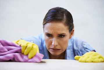 Image showing Woman, gloves and cleaning table in home, disinfection and remove dirt or bacteria for maintenance. Female person, housekeeeping and wash with detergent or sanitation, maid and chemical for germs