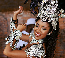 Image showing Performer, samba and dance with show, smile and makeup for concert or party. Brazilian woman, celebration and feather for culture, talent and creative artist for rio de janeiro carnival event