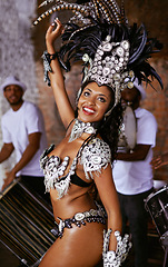 Image showing Woman, samba and performance with festival, smile and makeup for concert or party. Brazilian dancer, celebration and feather for culture, talent and creative artist for rio de janeiro carnival event
